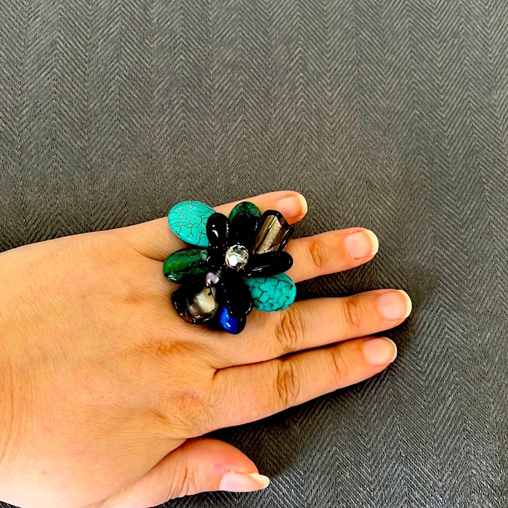 Adjustable blue and black ring